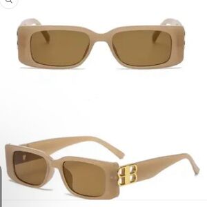 Tan sunglasses with gold accents